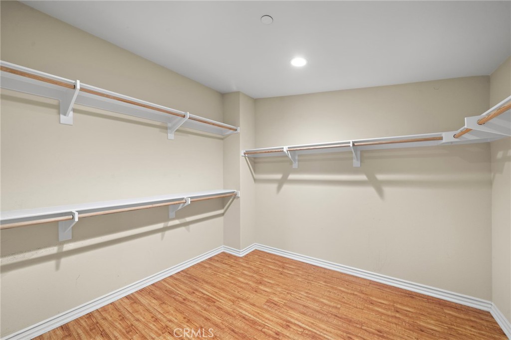 Primary bedroom's walk-in Closet - 9042 Lemongrass Court, Fountain Valley CA 92708 - photo 36
