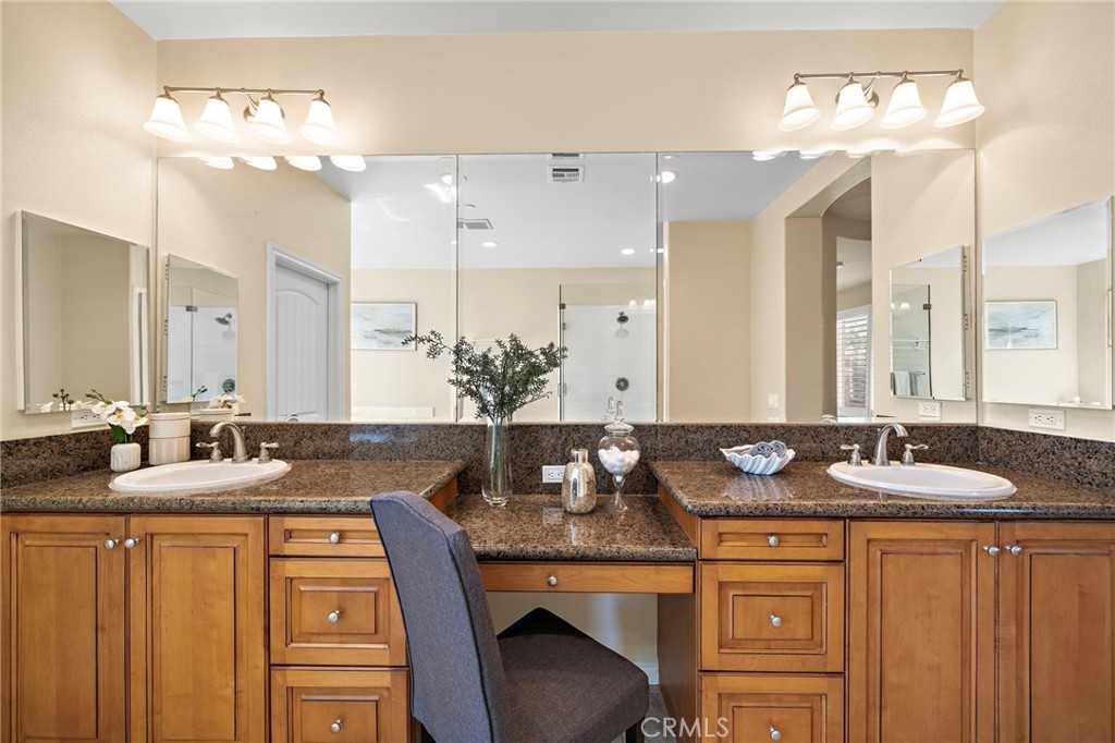 Primary bedroom bathroom vanity - 9042 Lemongrass Court, Fountain Valley CA 92708 - photo 38