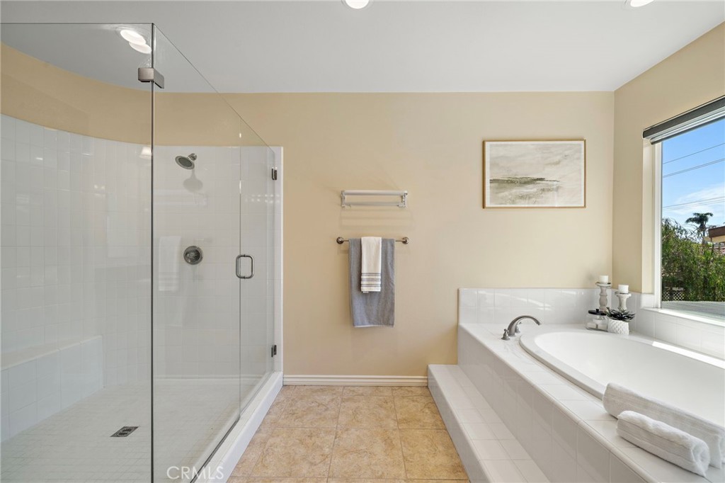 Primary bedroom bathroom shower area - 9042 Lemongrass Court, Fountain Valley CA 92708 - photo 39