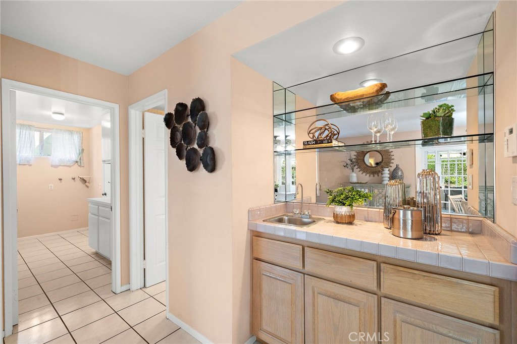 Built-in wet bar with display shelving - 9115 McBride River Avenue, Fountain Valley CA 92708 - photo 22