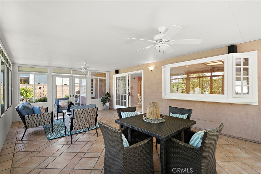Sunroom with flexible space for dining and relaxation - 9115 McBride River Avenue, Fountain Valley CA 92708 - photo 27