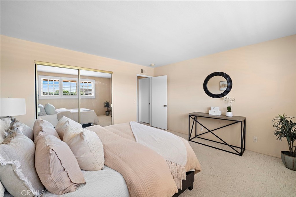 Bedroom #2 has mirrored closet doors - 9115 McBride River Avenue, Fountain Valley CA 92708 - photo 35