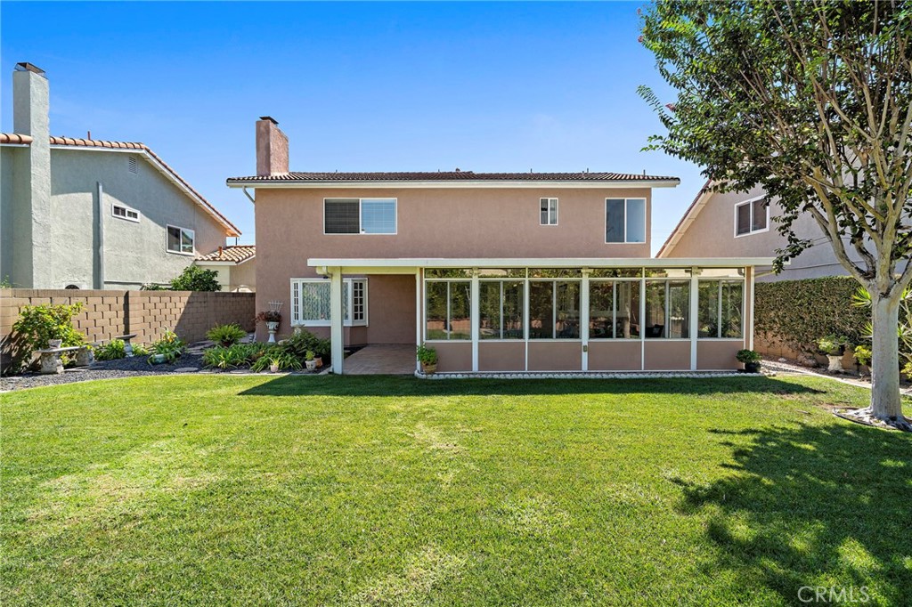 Rear view of the home and expansive lawn - 9115 McBride River Avenue, Fountain Valley CA 92708 - photo 45
