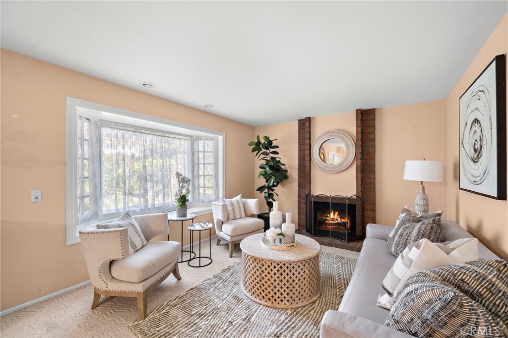 Warm and inviting family room with natural light and comfortable gathering space. - 9115 McBride River Avenue, Fountain Valley CA 92708 - photo 16