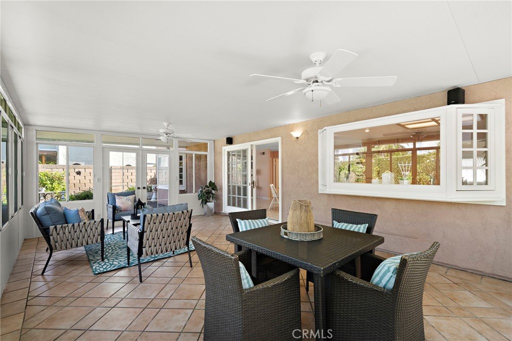 Flexible sunroom layout with room to gather, dine or unwind. - 9115 McBride River Avenue, Fountain Valley CA 92708 - photo 27