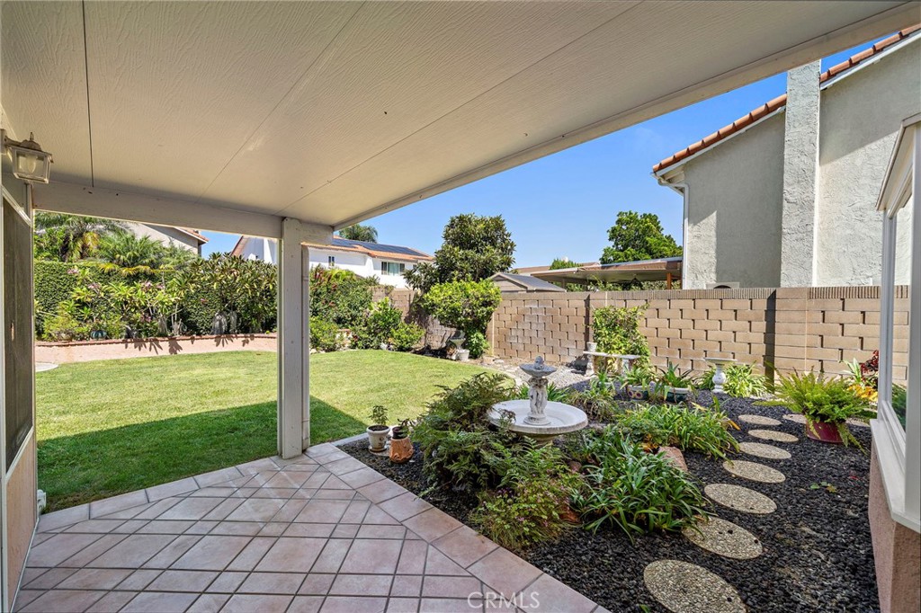 Covered backyard patio offers a shaded spot to relax outdoors. - 9115 McBride River Avenue, Fountain Valley CA 92708 - photo 41