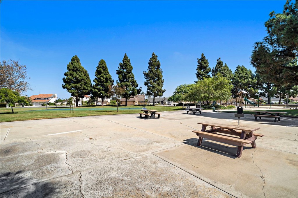 Outdoor picnic tables offer space to gather at the park. - 9115 McBride River Avenue, Fountain Valley CA 92708 - photo 54