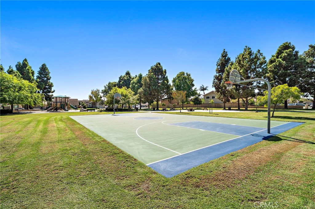 Park recreation court surrounded by open lawn and mature trees. - 9115 McBride River Avenue, Fountain Valley CA 92708 - photo 55