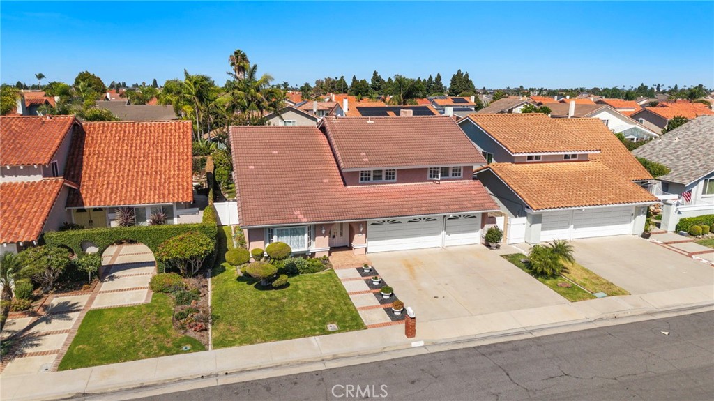Elevated front view highlights the home, driveway and landscaped yard. - 9115 McBride River Avenue, Fountain Valley CA 92708 - photo 56