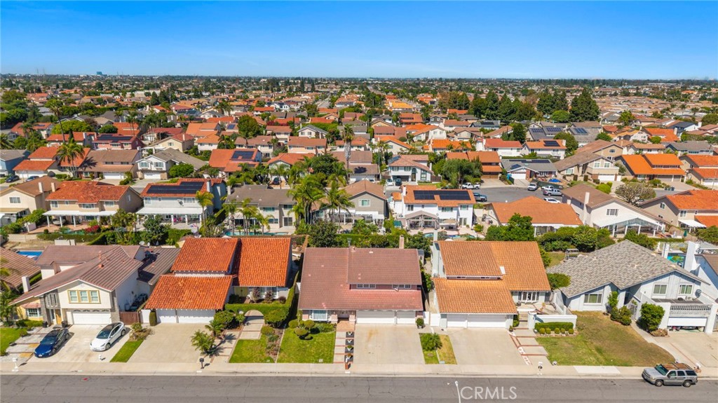 Neighborhood aerial with a broad view of nearby homes and streets. - 9115 McBride River Avenue, Fountain Valley CA 92708 - photo 60