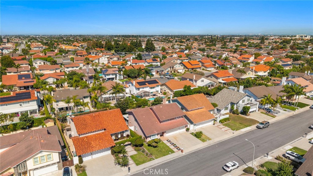 Elevated neighborhood view with rows of homes and mature landscaping. - 9115 McBride River Avenue, Fountain Valley CA 92708 - photo 61