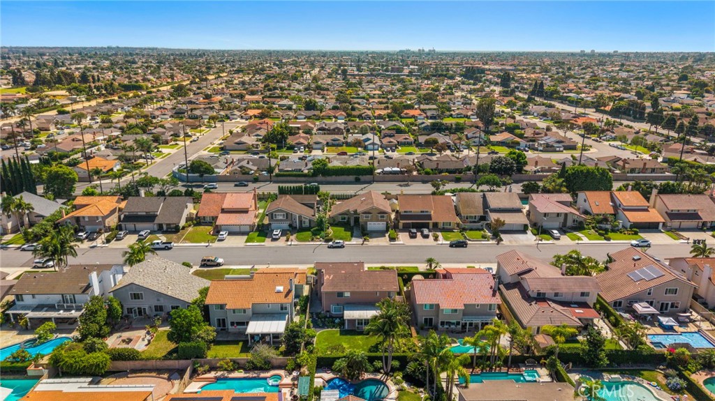Broad neighborhood aerial with tree-lined residential streets. - 9115 McBride River Avenue, Fountain Valley CA 92708 - photo 68