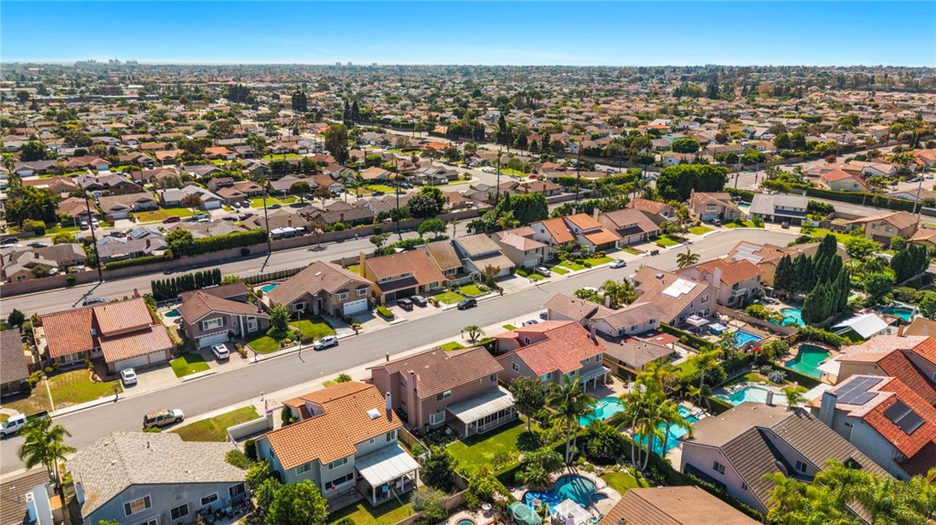 Sweeping aerial view of the surrounding homes and streets. - 9115 McBride River Avenue, Fountain Valley CA 92708 - photo 69