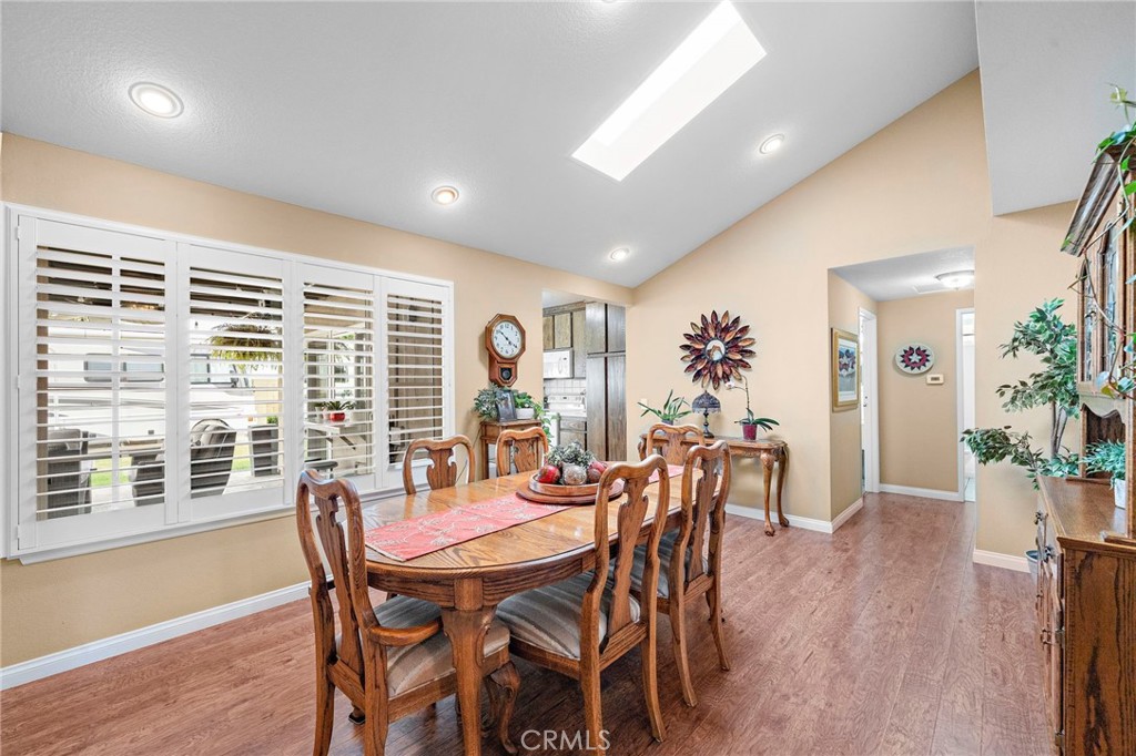 dining room windows with wood shutters and dual pane windows - 9735 Hibiscus Avenue, Fountain Valley CA 92708 - photo 7
