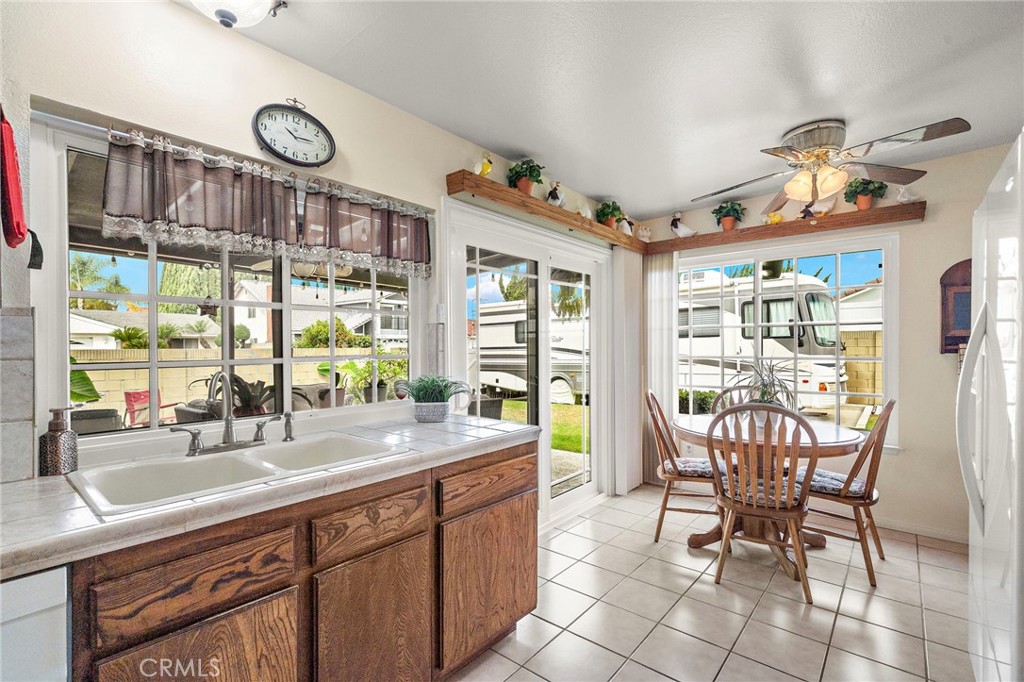 dual pane sliding glass windows lead to the backyard - 9735 Hibiscus Avenue, Fountain Valley CA 92708 - photo 12