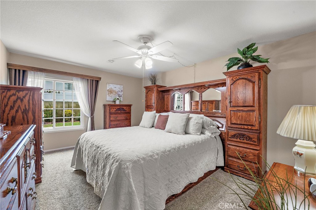 primary suit with large window with view of the backyard - 9735 Hibiscus Avenue, Fountain Valley CA 92708 - photo 15