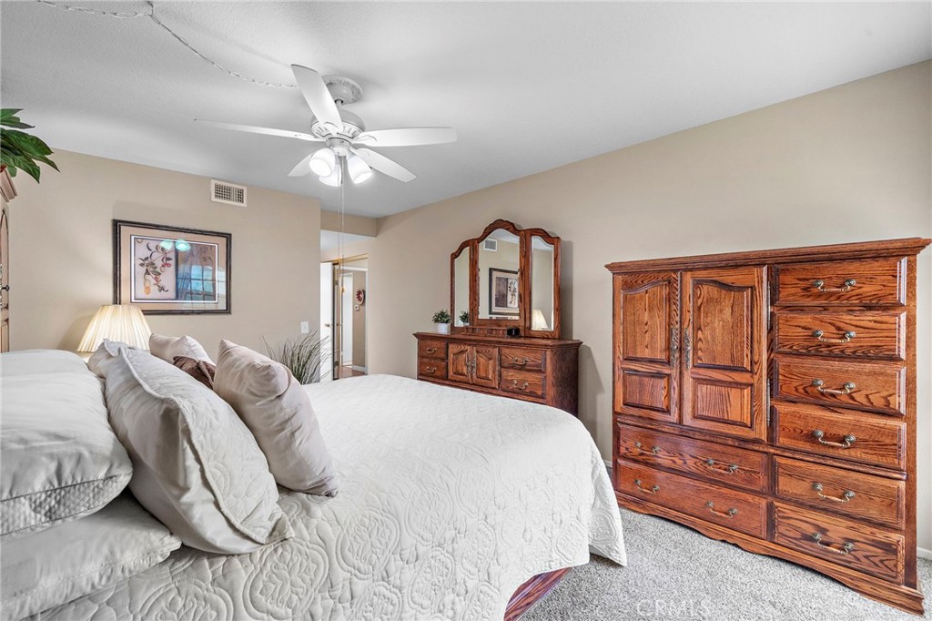 primary suite with ceiling fan - 9735 Hibiscus Avenue, Fountain Valley CA 92708 - photo 16