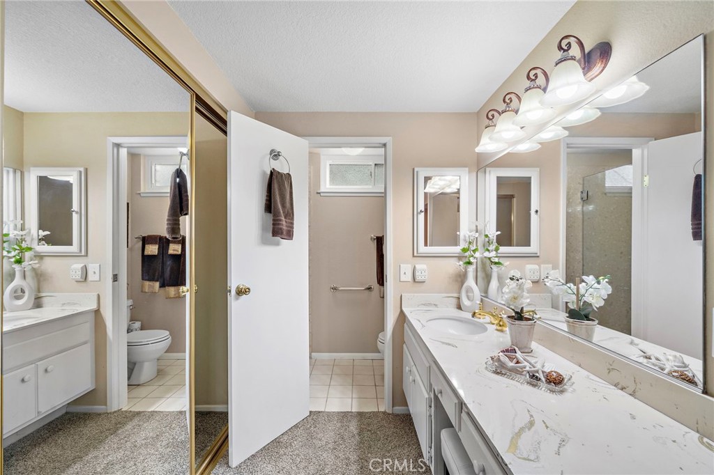 primary suite bathroom with sit down vanity - 9735 Hibiscus Avenue, Fountain Valley CA 92708 - photo 17