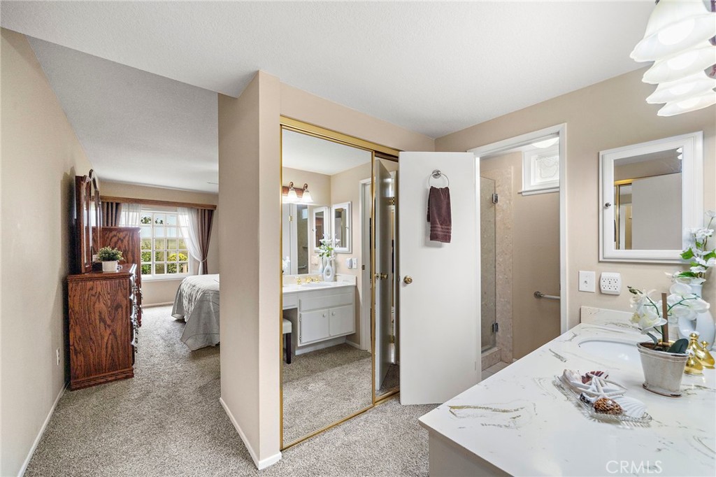primary suite bath with 2 mirrored closets - 9735 Hibiscus Avenue, Fountain Valley CA 92708 - photo 18