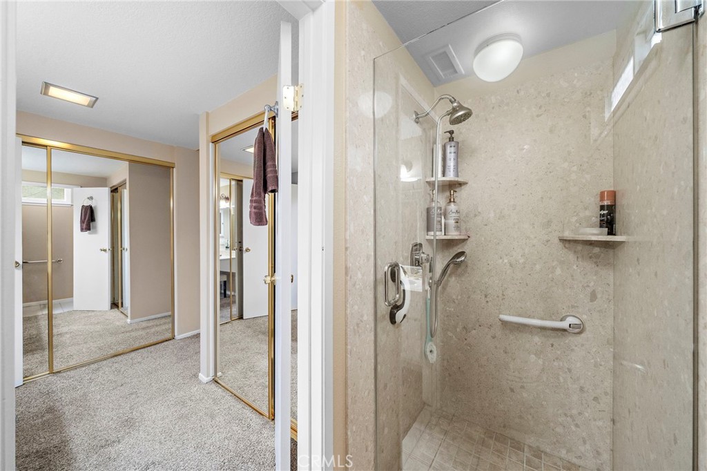 primary suite bath with walk in shower - 9735 Hibiscus Avenue, Fountain Valley CA 92708 - photo 19