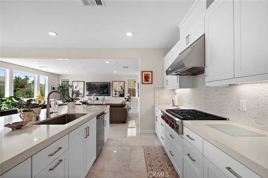 quartz countertops, Wolf stainless steel appliances, Sub-Zero refrigerator, sleek soft-close cabinetry, butler's pantry, - 9896 Heron Avenue, Fountain Valley CA 92708 - photo 11