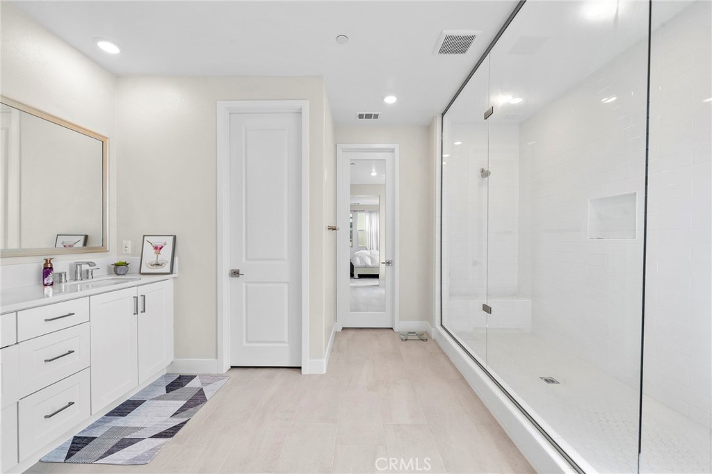 Primary Suite Bathroom with Oversized Shower with Sitting Bench, Dual Sinks, and Privacy Toilet - 9896 Heron Avenue, Fountain Valley CA 92708 - photo 21