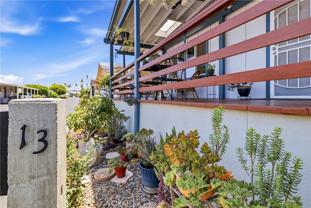 Front exterior offers established flower beds with rock accents, ready for your personal touch to create a warm and invi - 1201 W Valencia Drive 13, Fullerton CA 92833 - photo 8