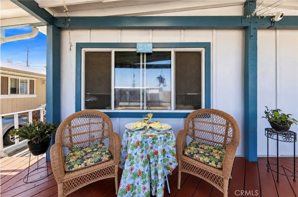 The covered outdoor patio is the perfect spot for cozy dining, morning coffee, or evening relaxation while enjoying the - 1201 W Valencia Drive 13, Fullerton CA 92833 - photo 10