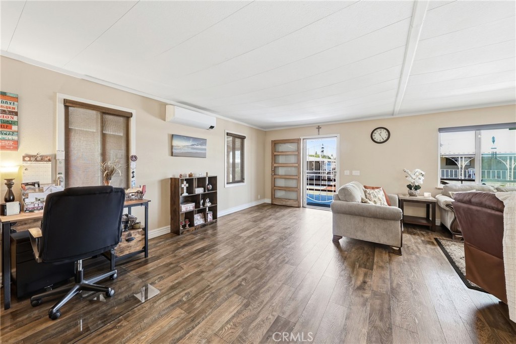 The spacious open area offers endless possibilities and can easily be configured into two separate rooms to accommodate - 1201 W Valencia Drive 13, Fullerton CA 92833 - photo 11