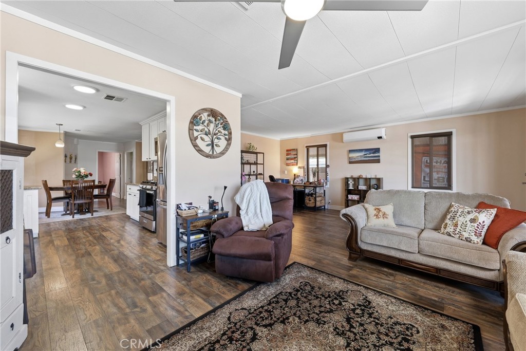 The heart of the home features a seamless combination of the living room, family room, and kitchen, offering an expansiv - 1201 W Valencia Drive 13, Fullerton CA 92833 - photo 12