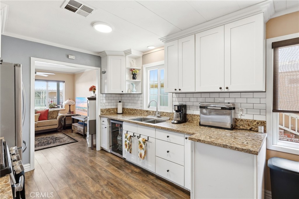 Wine refrigerator is excluded from the sale and will accompany the seller upon move-out. - 1201 W Valencia Drive 13, Fullerton CA 92833 - photo 16