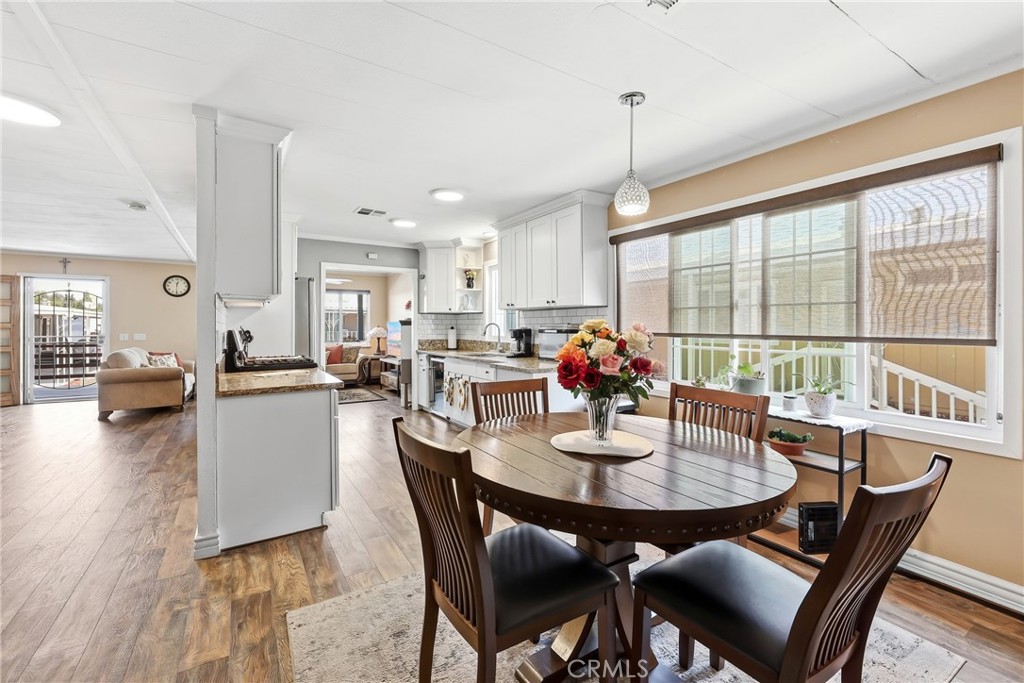 Another View of the kitchen, living room, and family room. - 1201 W Valencia Drive 13, Fullerton CA 92833 - photo 18