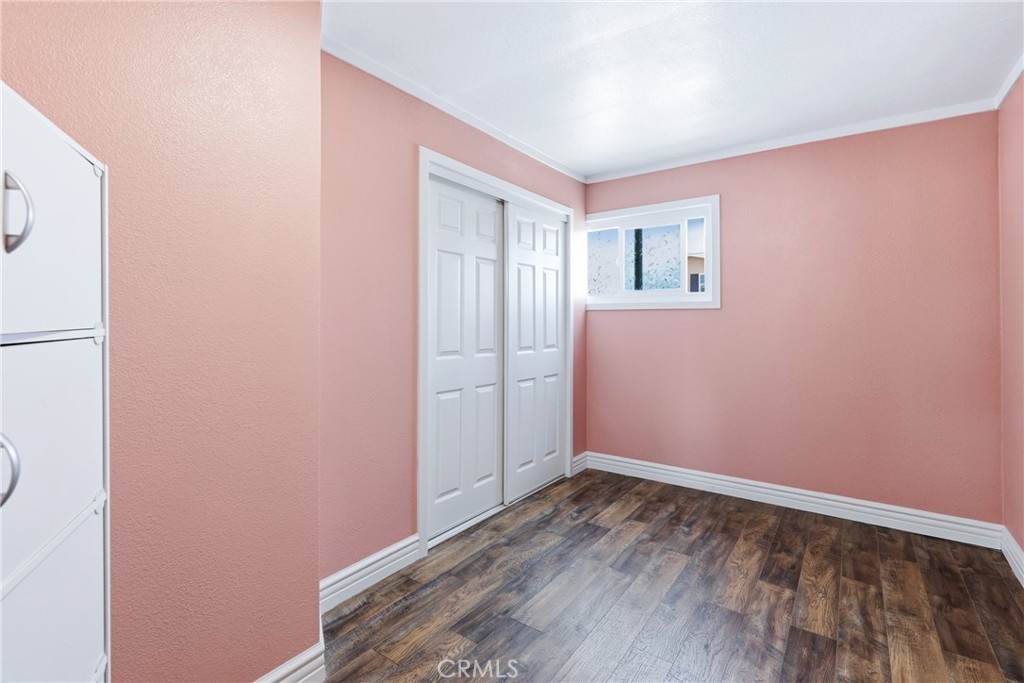 Guest bedroom with a large closet and plenty of space for comfortable living. Conveniently located adjacent to the guest - 1201 W Valencia Drive 13, Fullerton CA 92833 - photo 21