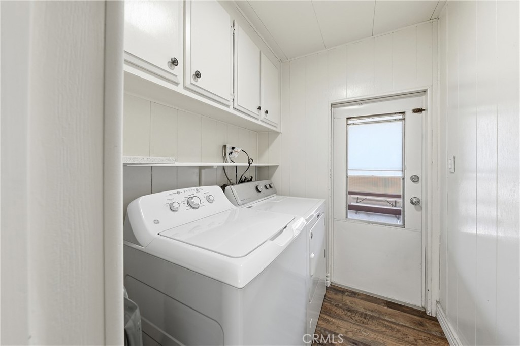 Functional laundry room with generous storage, direct carport access, and washer and dryer included for added convenienc - 1201 W Valencia Drive 13, Fullerton CA 92833 - photo 25