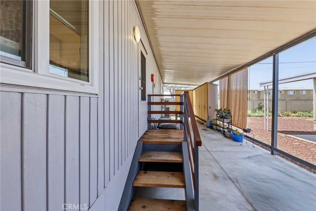 Side entry under the carport opens directly into the laundry room for convenient access to the home. The tandem carport - 1201 W Valencia Drive 13, Fullerton CA 92833 - photo 26