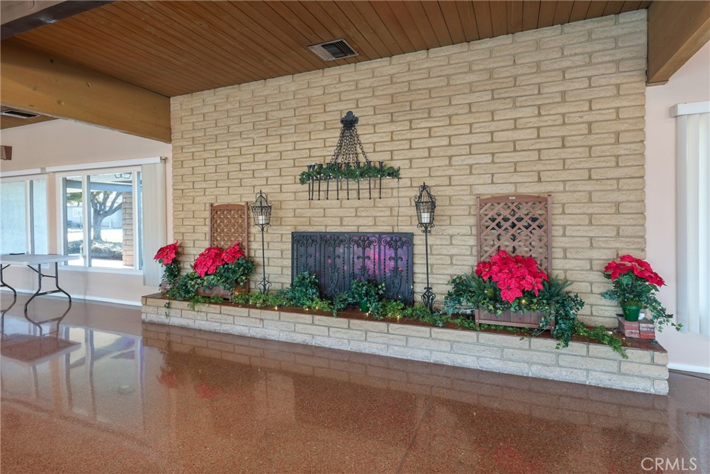 Clubhouse with cozy fireplace and inviting ambiance. - 1201 W Valencia Drive 13, Fullerton CA 92833 - photo 34