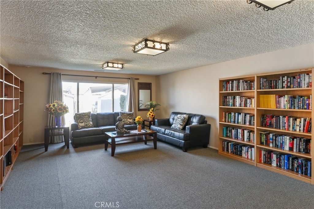 The clubhouse library offers plenty of lighting and comfortable seating, creating a quiet and inviting space for reading - 1201 W Valencia Drive 13, Fullerton CA 92833 - photo 35