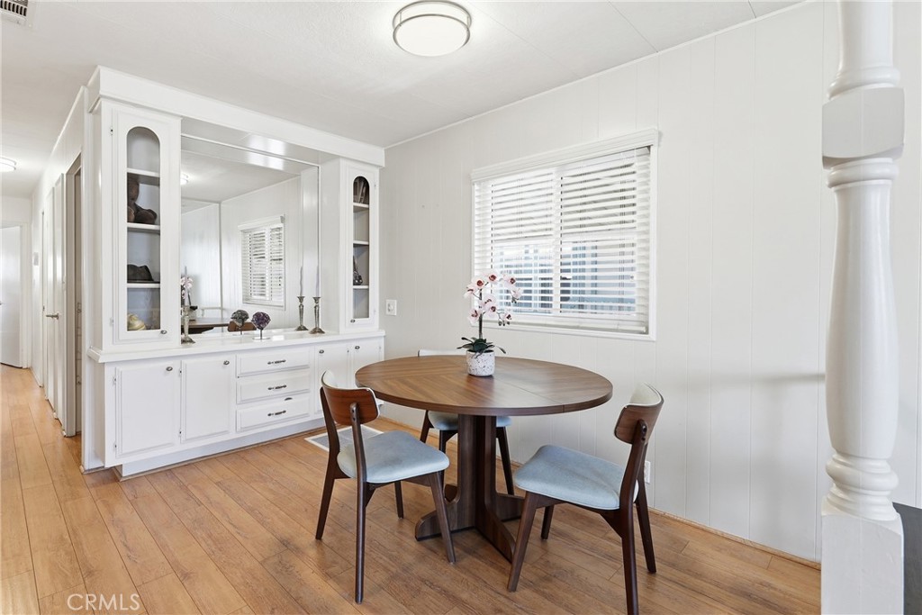 Spacious dining area with ample seating and an abundance of natural light. - 1201 W Valencia Drive 69, Fullerton CA 92833 - photo 9