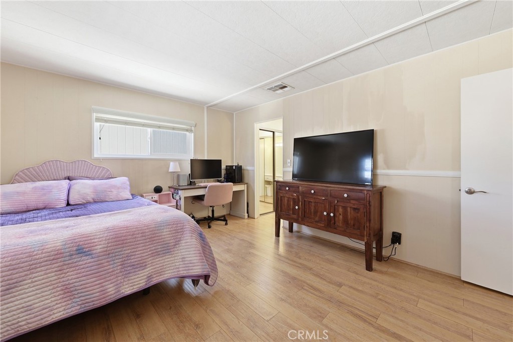 Take a look at this spacious primary bedroom, offering plenty of room for comfort and relaxation - 1201 W Valencia Drive 69, Fullerton CA 92833 - photo 15