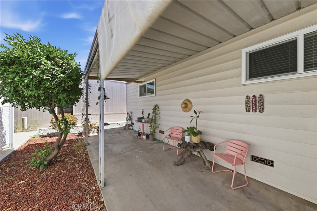 Another view of the cozy outdoor patio—perfect for barbecuing, conversation seating, and relaxing outdoors. - 1201 W Valencia Drive 69, Fullerton CA 92833 - photo 25