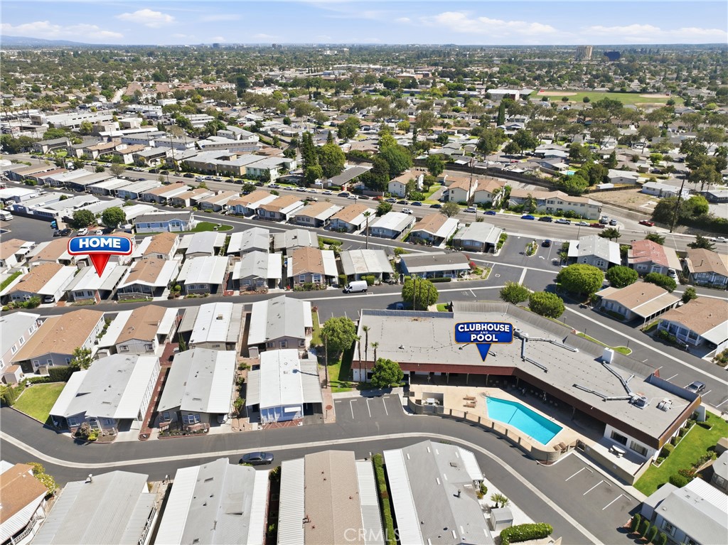 Aerial drone view highlighting the home’s convenient location just steps from the clubhouse and community pool. - 1201 W Valencia Drive 69, Fullerton CA 92833 - photo 28