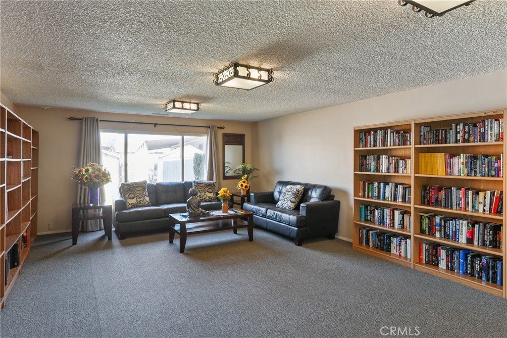 The clubhouse features an extensive library, offering a comfortable and quiet space to read and relax. - 1201 W Valencia Drive 69, Fullerton CA 92833 - photo 35