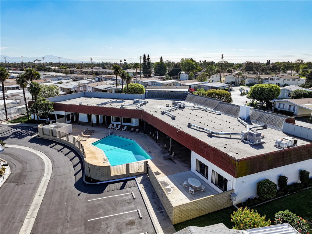 The spacious pool area offers plenty of room for relaxing, socializing, and enjoying the sunshine. - 1201 W Valencia Drive 69, Fullerton CA 92833 - photo 37