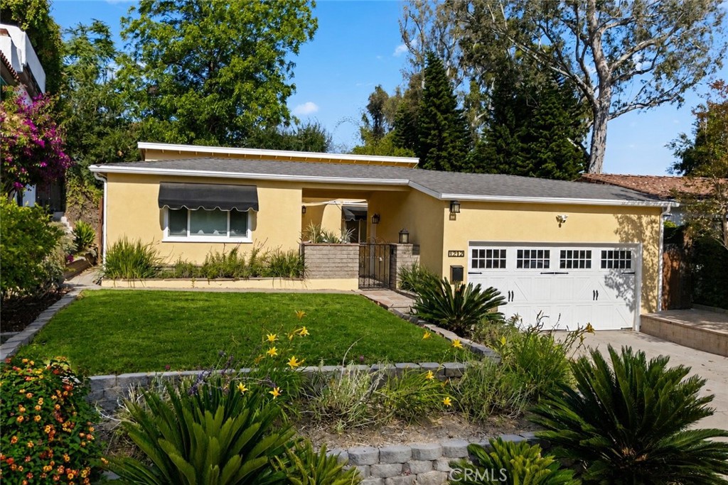 Beautiful curb appeal welcomes you home with mature landscaping, updated exterior finishes, and a private gated courtyar - 1212 N Lemon, Fullerton CA 92831 - photo 1