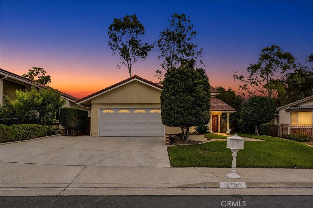 Photo enhanced to twilight for marketing purposes. - 1218 Summersworth Place, Fullerton CA 92833 - photo 1
