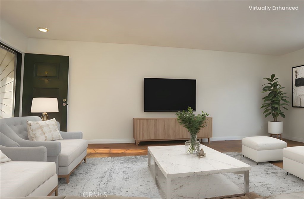 Living room - Virtually staged with REimagineHome - All furniture, throw rug, plants, TV, and art on the wall was added - 2014 Associated Rd 2, Fullerton CA 92831 - photo 1