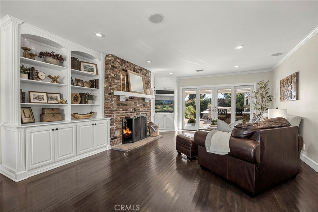 Inviting living space showcases beautiful wood floors, abundant natural light and seamless flow to the kitchen and dinin - 2100 Yucca Avenue, Fullerton CA 92835 - photo 6