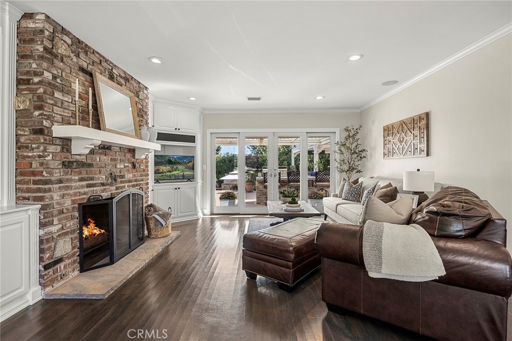 Multiple doors open the interior living spaces to a spacious covered patio, creating effortless indoor-outdoor entertain - 2100 Yucca Avenue, Fullerton CA 92835 - photo 7