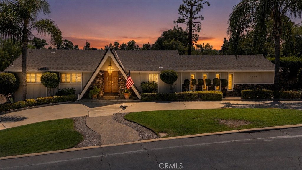 Front of the house facing north with a circular driveway. - 2326 Almira Avenue, Fullerton CA 92831 - photo 1
