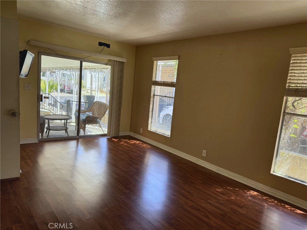 Spacious primary bedroom with sliding glass door - 2851 Rolling Hills 187, Fullerton CA 92835 - photo 6